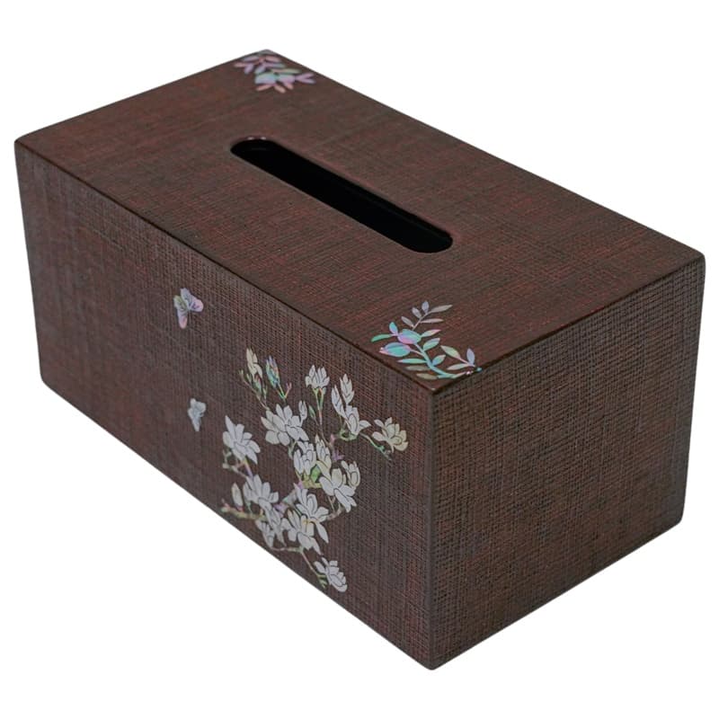 A rectangular brown tissue box cover with a delicate mother-of-pearl floral design on the side.