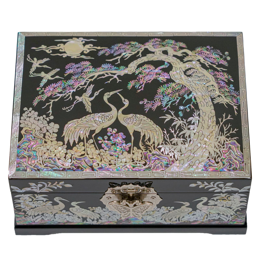 A square jewelry box with Mother of Pearl cranes and tree designs, featuring iridescent colors against a dark background.