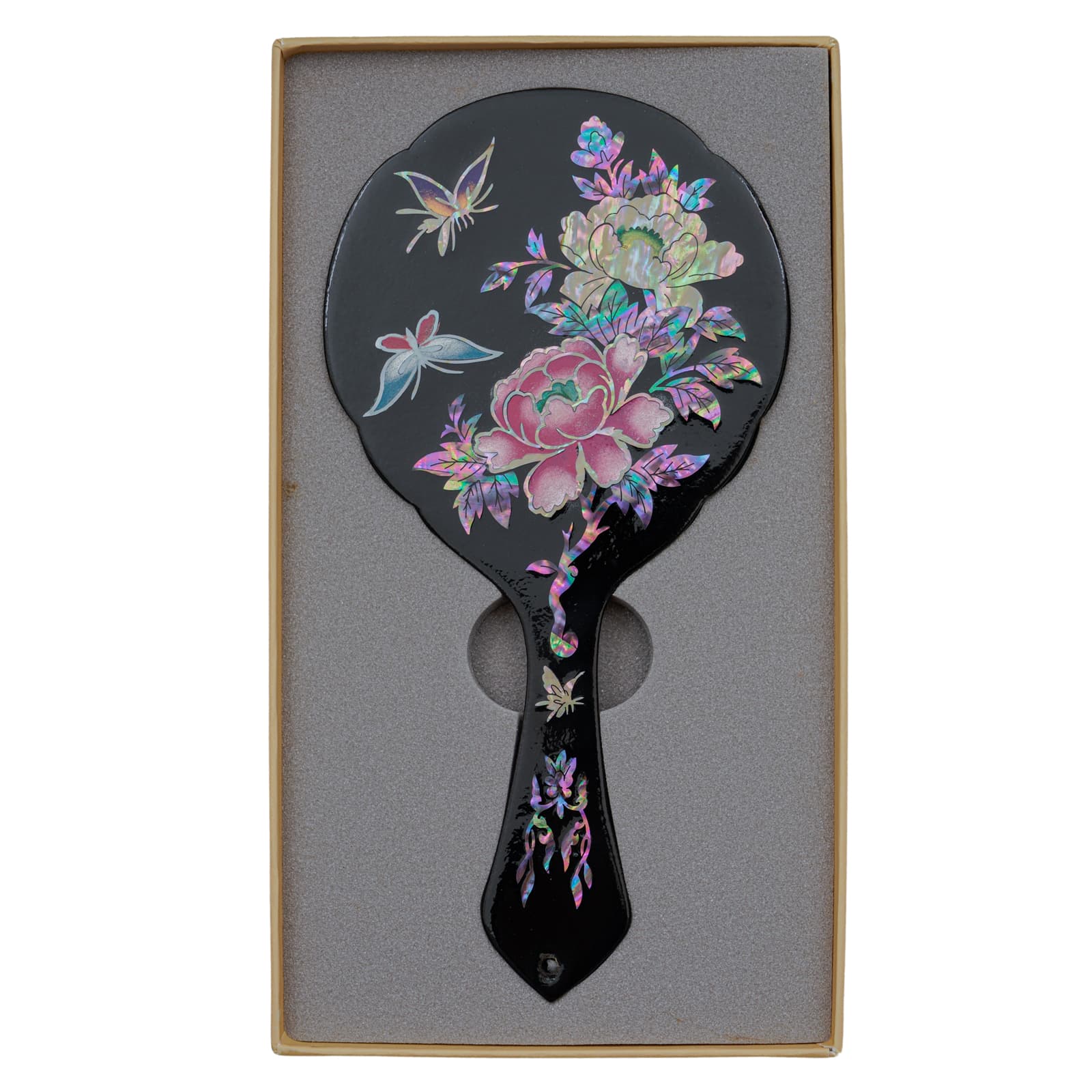 Black hand mirror with mother-of-pearl inlay of flowers and butterflies, displayed in a foam-lined box.