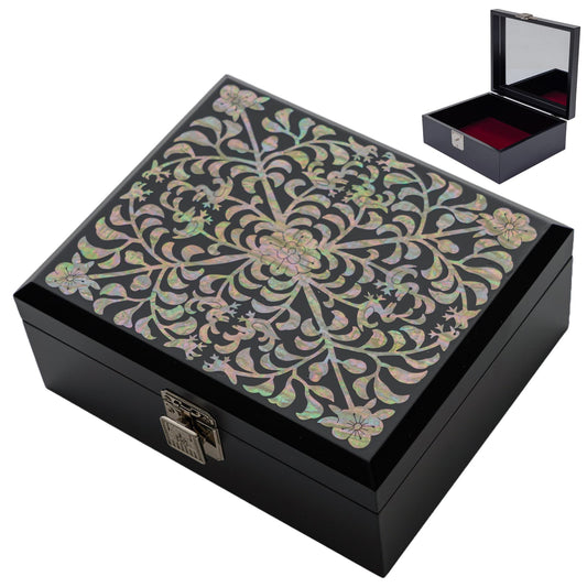 Black lacquered jewelry box with a mother-of-pearl floral pattern and mirror interior
