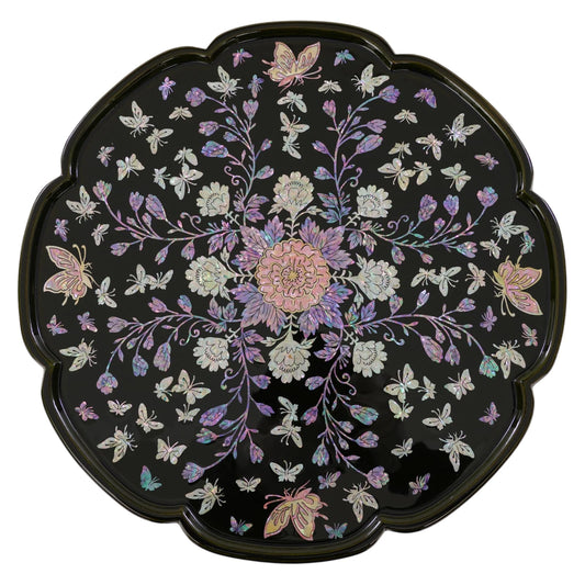 Black mother-of-pearl inlay tray table with scalloped edge, featuring butterfly and floral design on glossy lacquer surface, traditional Korean handcrafted decor table.