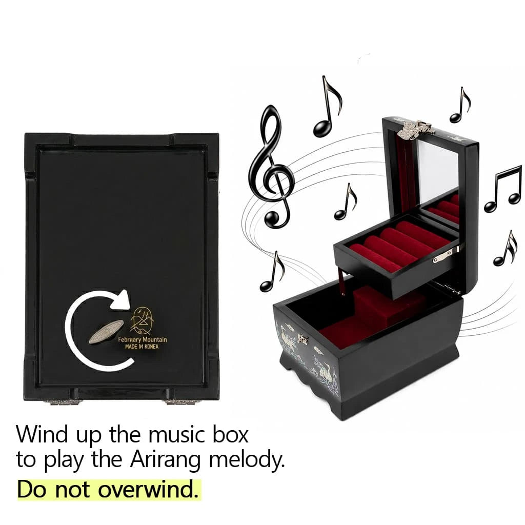 Black mother-of-pearl jewelry box with a red velvet interior, mirror, and tiered ring holder. Bottom view shows a metal wind-up key for the music box