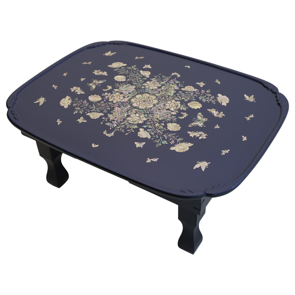 Blue Table with detailed mother-of-pearl floral pattern.