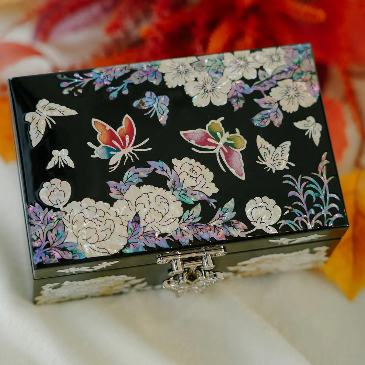 Butterfly and cherry blossom mother of pearl jewelry box, black lacquer with white peonies