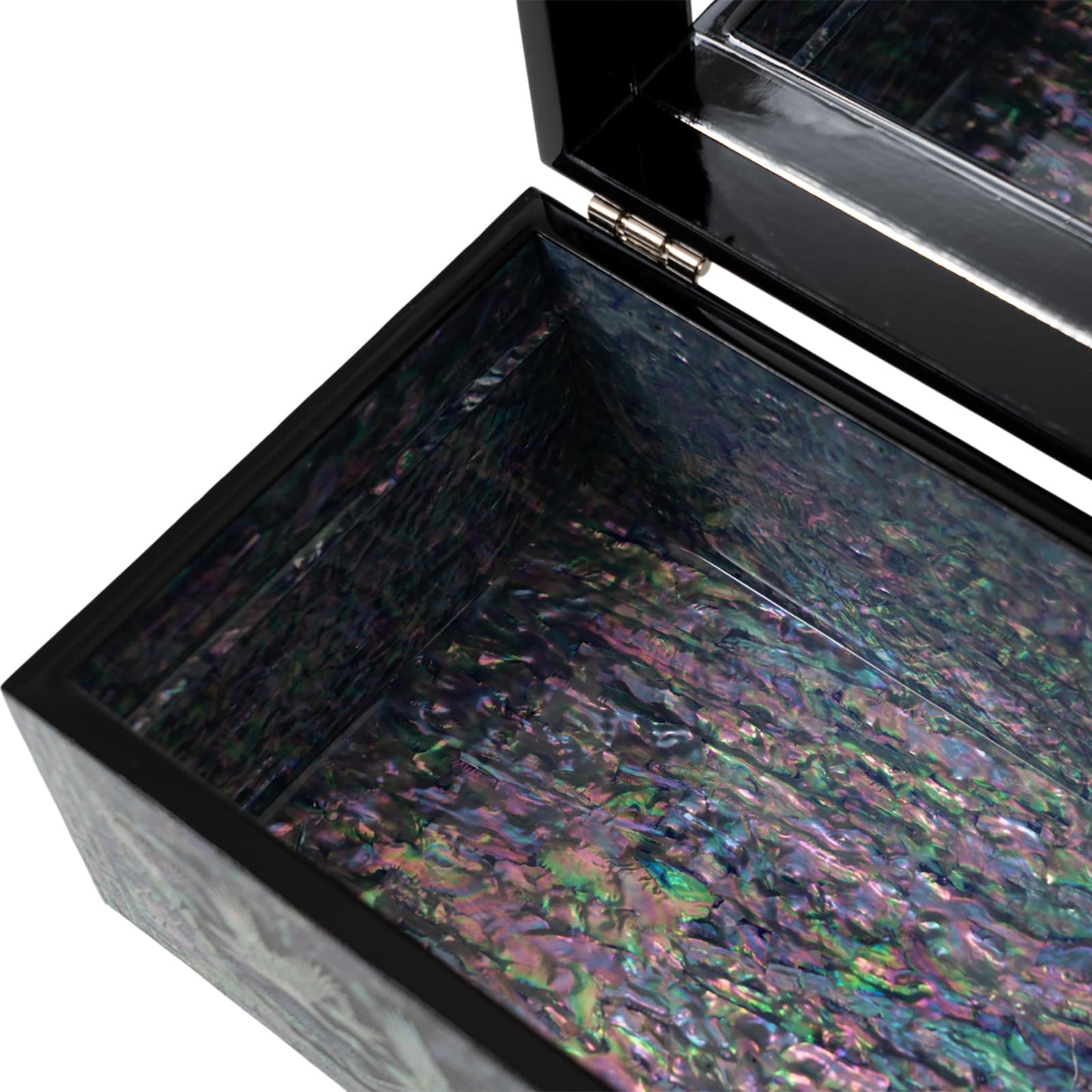 Close-up of jewelry box interior showing natural mother-of-pearl shell texture and hinge