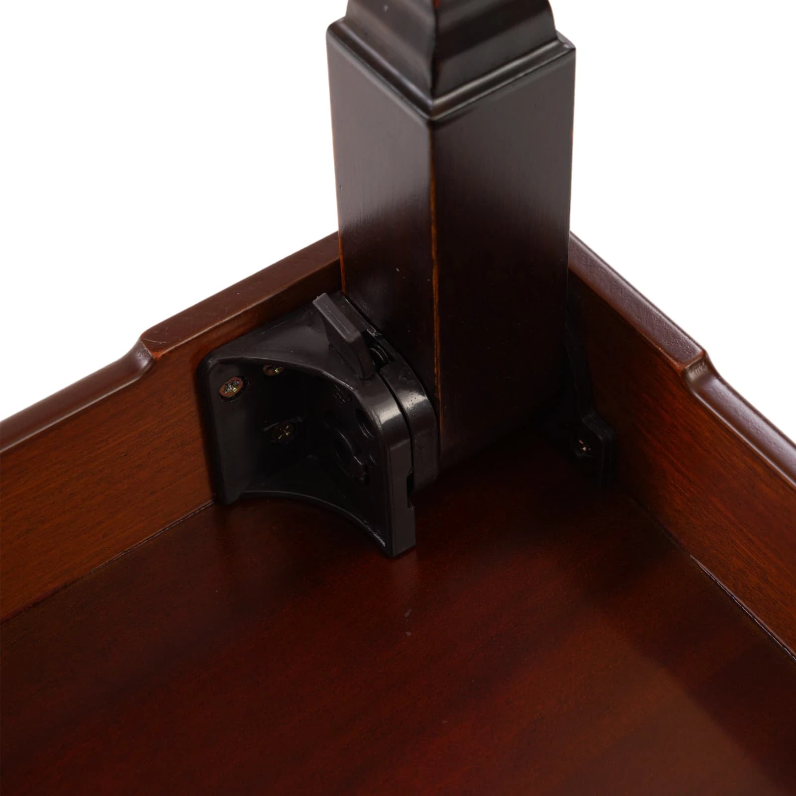 Close-up of the durable black plastic folding hinge and locking mechanism on the underside of a portable Korean dining table for easy storage