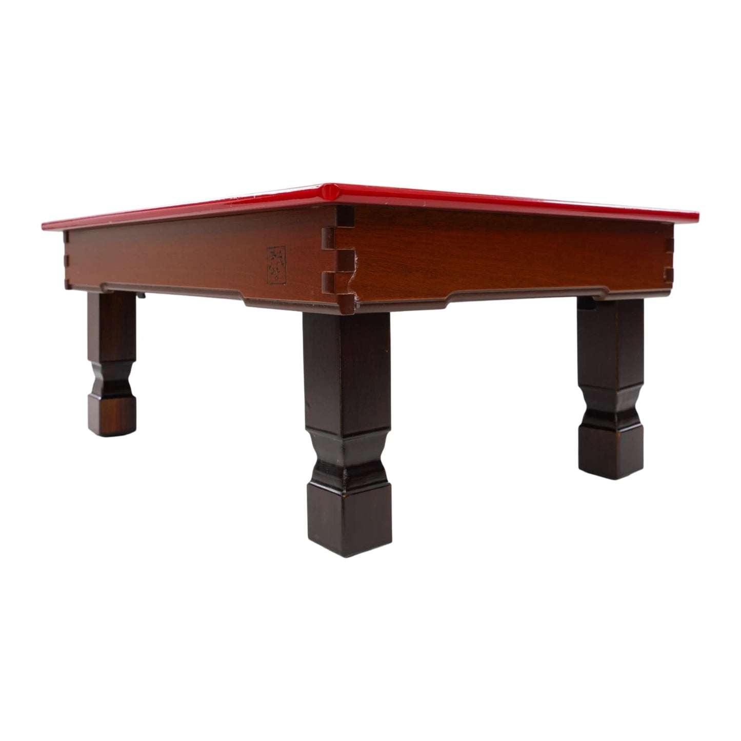 Dark brown solid wood low table with red lacquered top, traditional joinery corner details, and four sturdy square legs, minimal