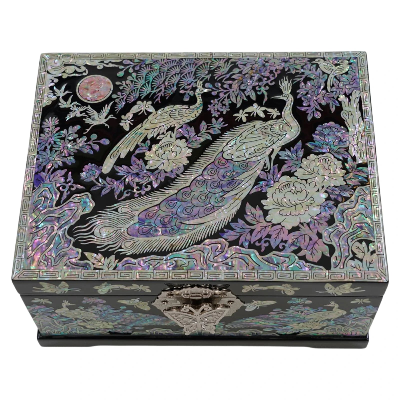 Detailed close-up of a black nacre lid showcasing stunning mother of pearl peacock, crane, and flower inlays within a geometric pattern border