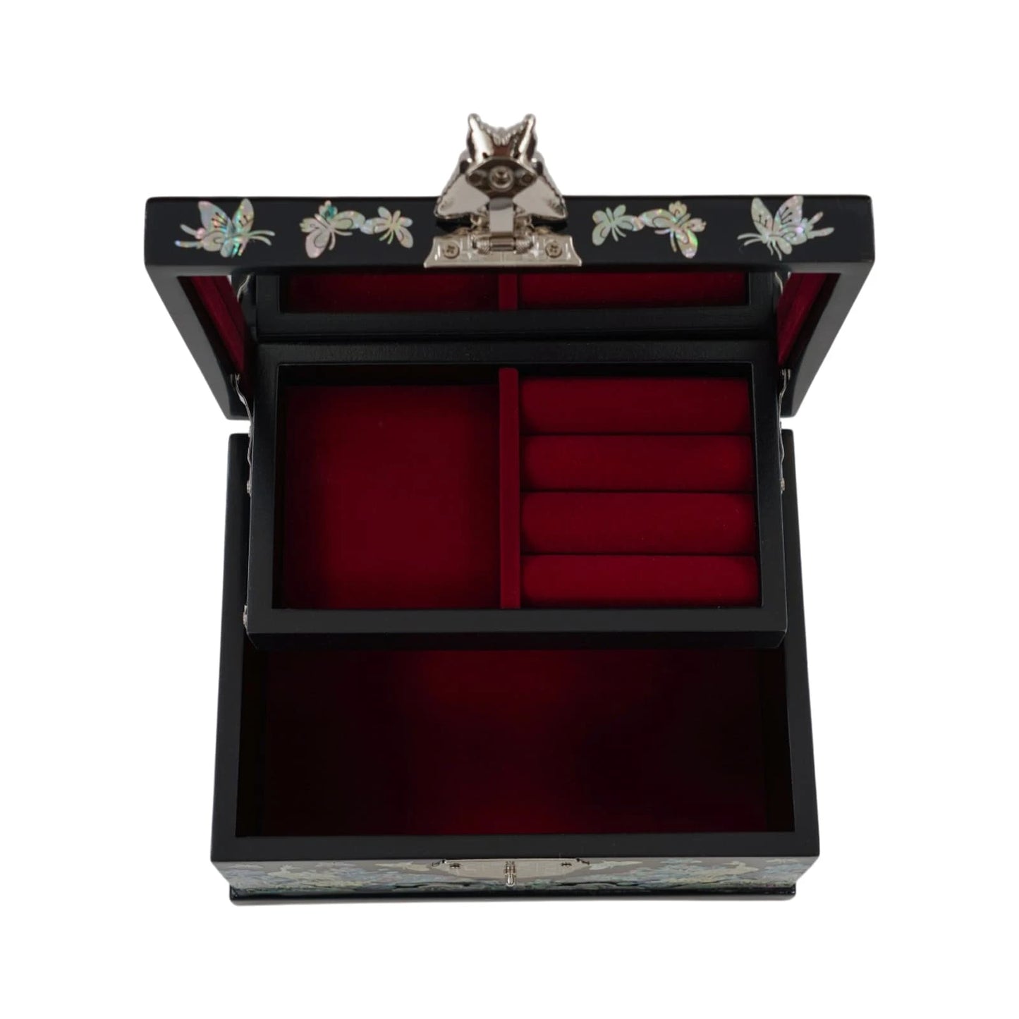 Direct overhead view of an open black jewelry box. Shows a large mirror on the lid, ring slots, and red velvet-lined compartments, secured by a lock