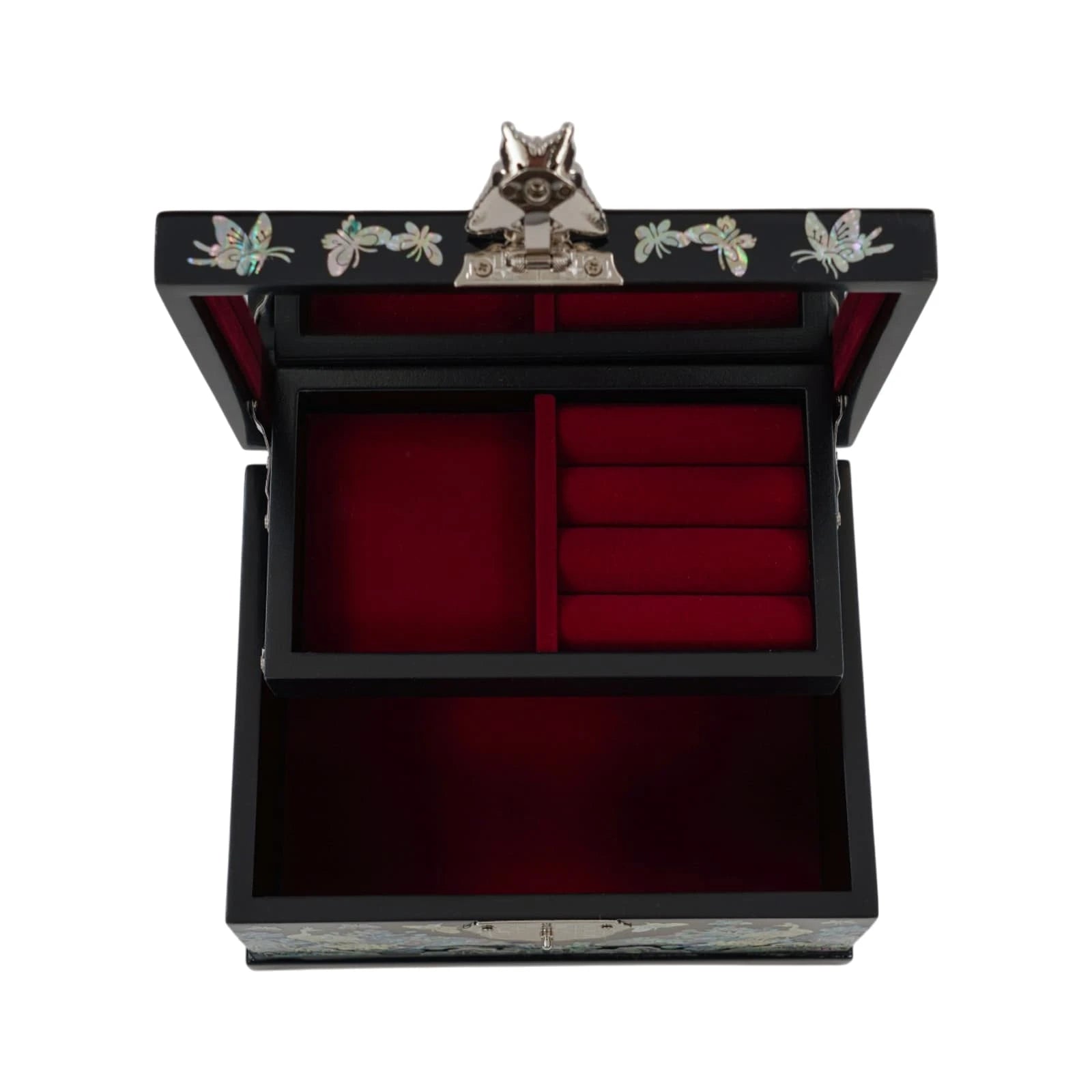 Direct overhead view of an open black jewelry box. Shows a large mirror on the lid, ring slots, and red velvet-lined compartments, secured by a lock
