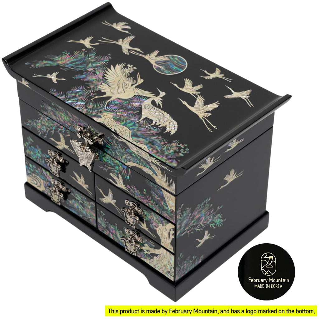 Elegant black jewelry box with mother-of-pearl crane design, multiple drawers, and a clasp. Korean-made by February Mountain.