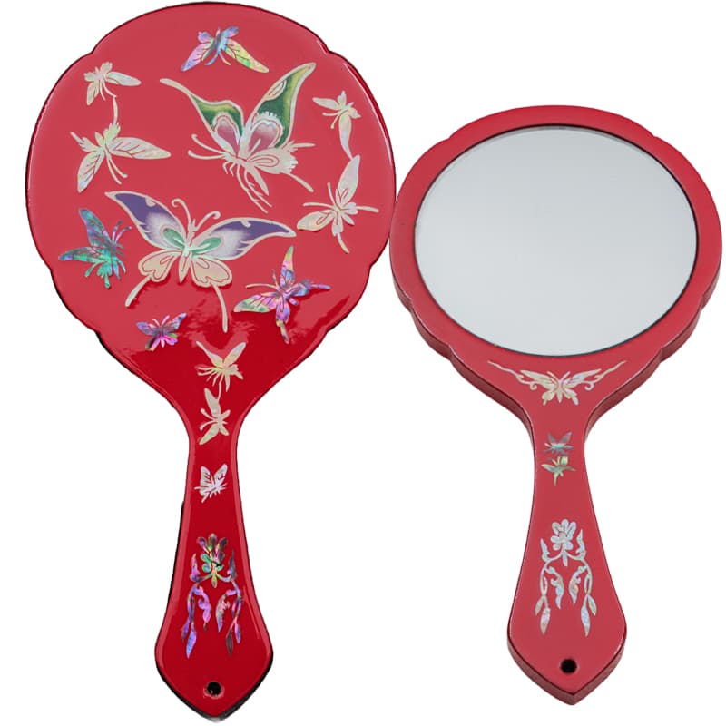 Front and back of a red hand mirror with mother-of-pearl inlay, showcasing colorful butterfly designs.