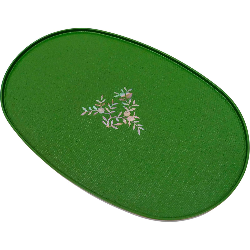 This is an image of an elliptical green tray with a mother-of-pearl floral design.