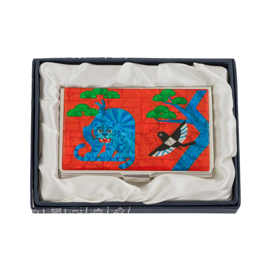 Metal case with a blue tiger and bird design in a silk-lined gift box