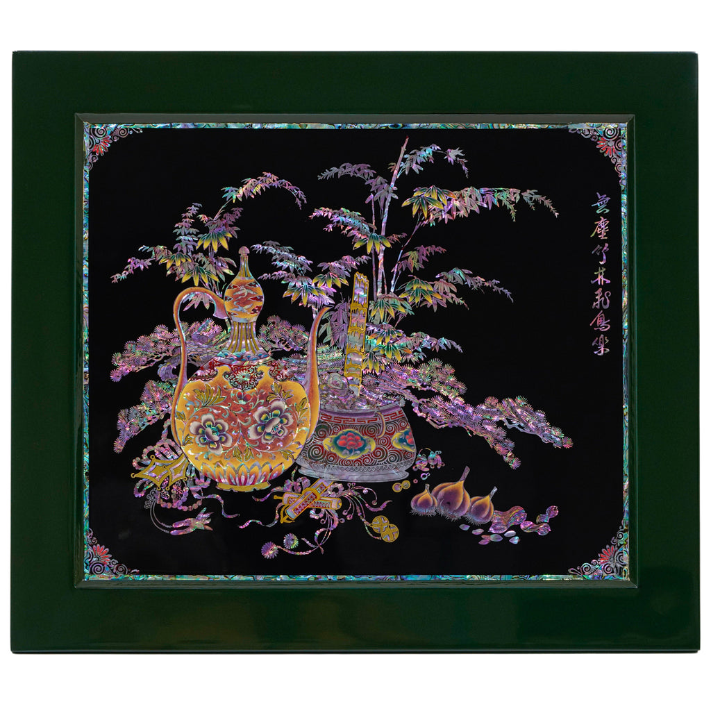 Korean mother of pearl artwork on a black backdrop, bordered by a dark green frame. Depicts radiant, multi-colored vases with intricate designs and lush trees with cascading branches. The whole piece is adorned with shimmering opalescent hues.