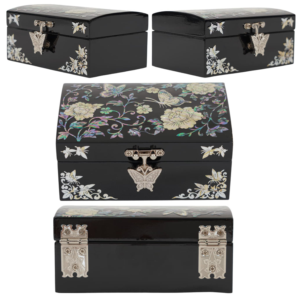 Multiple views of a black inlaid jewelry box with butterfly-shaped metal clasp