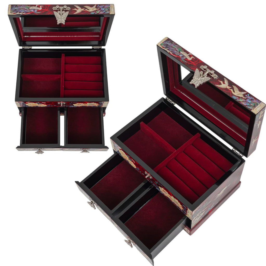Open red jewelry box with mirror, velvet interior, and ring slots visible from above