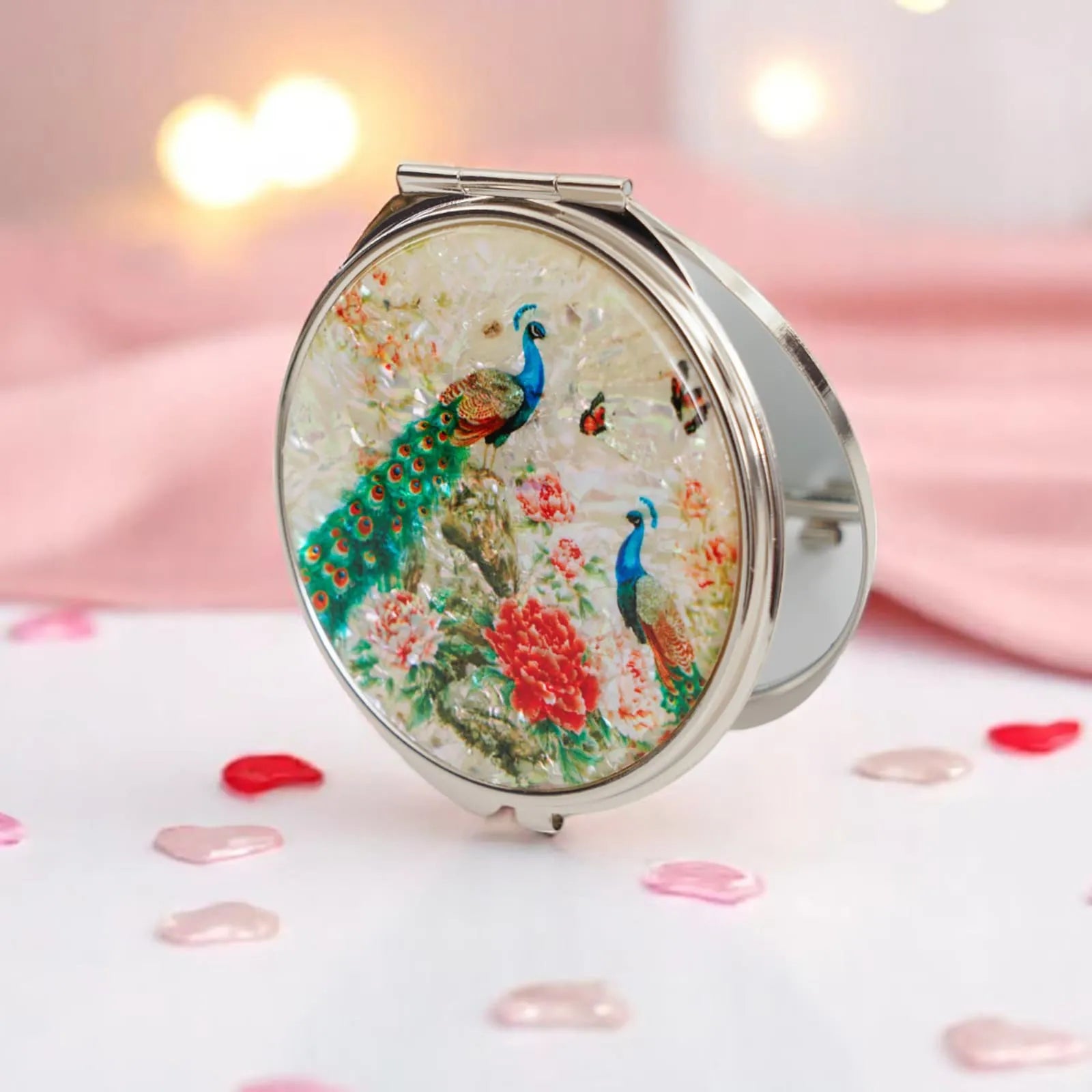 Round compact mirror with peacock and floral design on mother-of-pearl background