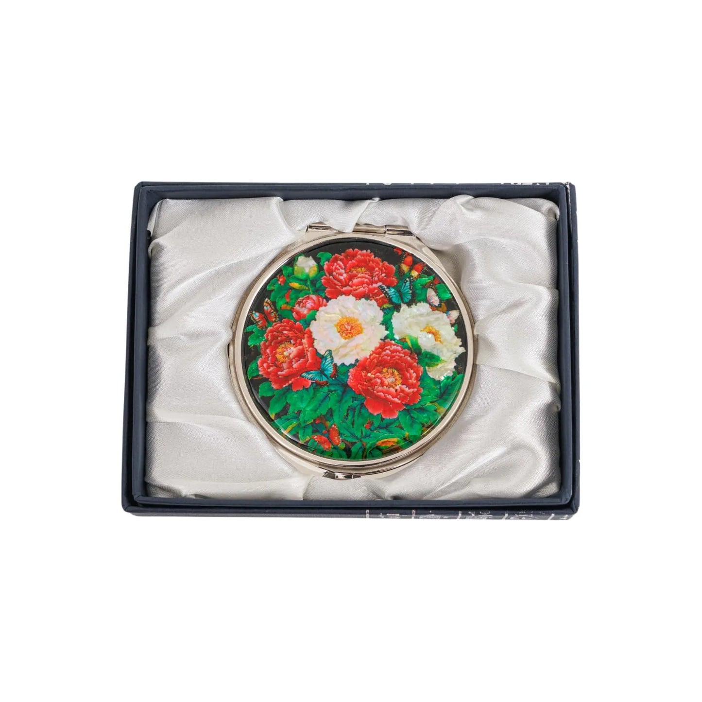 Round peony compact mirror in a silk-lined box, top-down product view