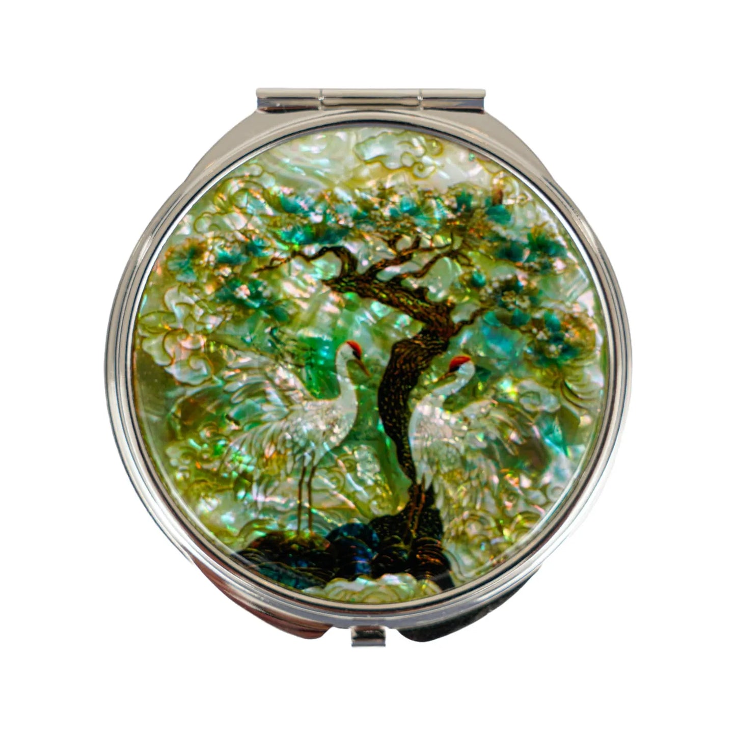 Compact mirror with nature-themed design on a white background