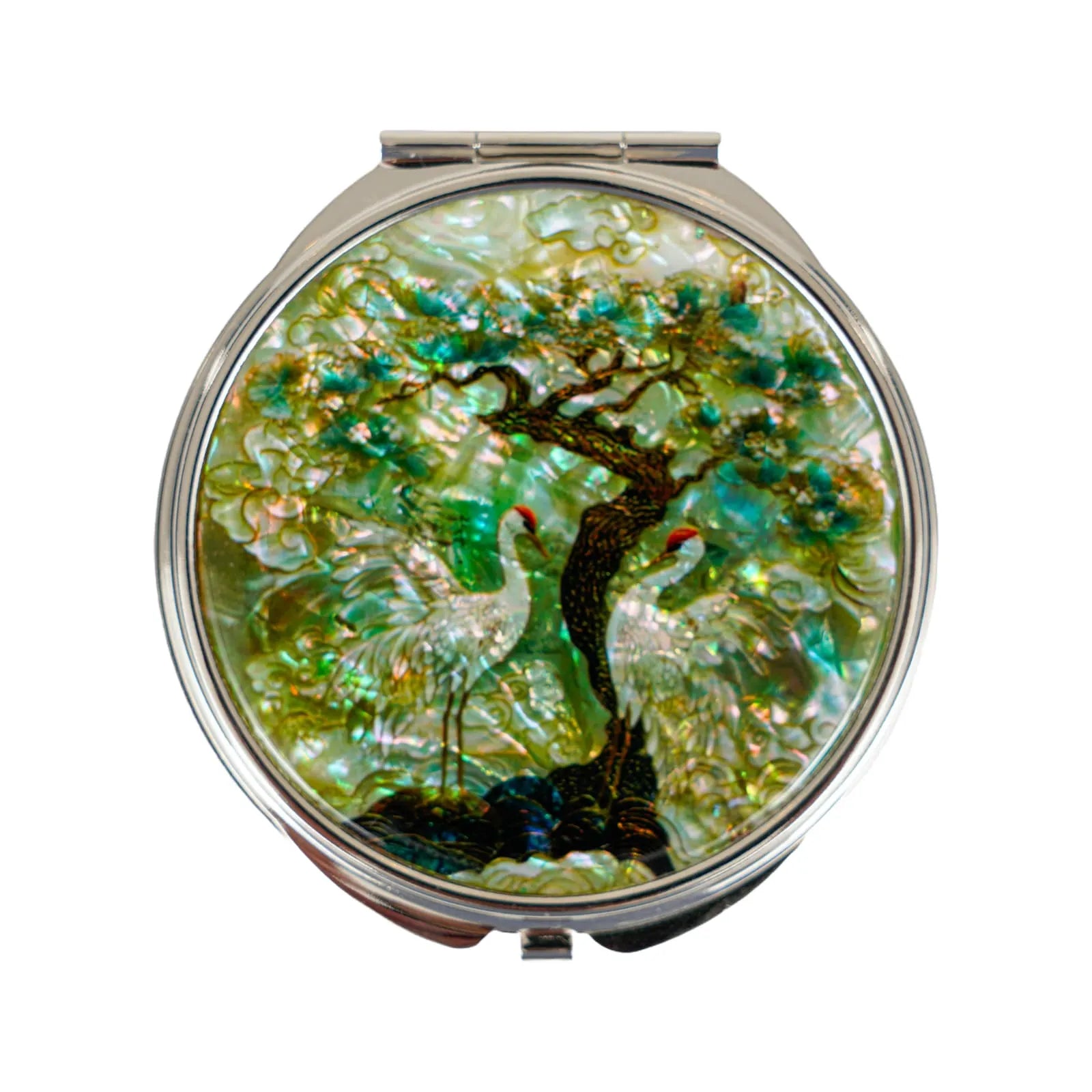 Compact mirror with nature-themed design on a white background