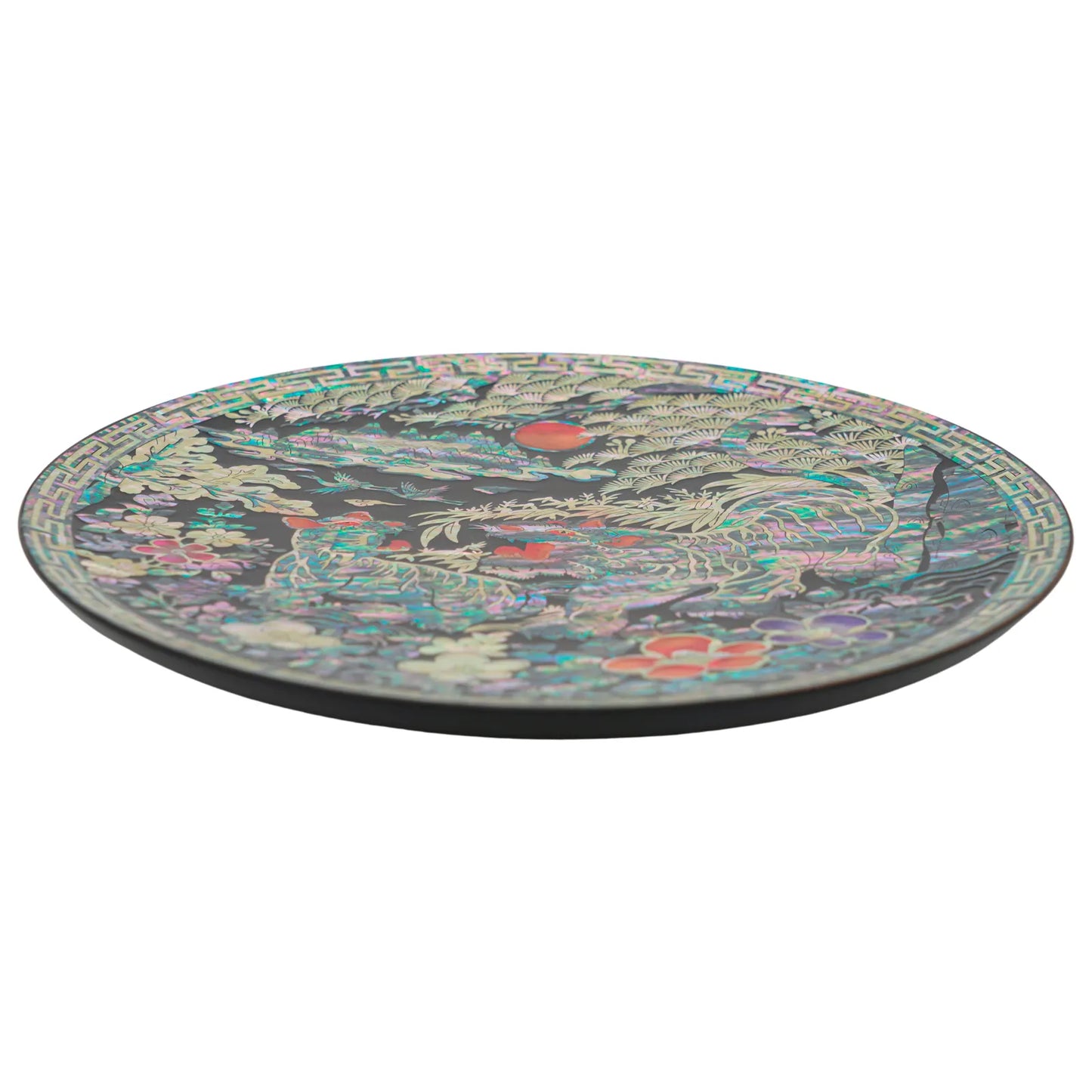 Side view of round mother of pearl decorative plate showing slim profile and smooth lacquered edge, premium handcrafted wall decor