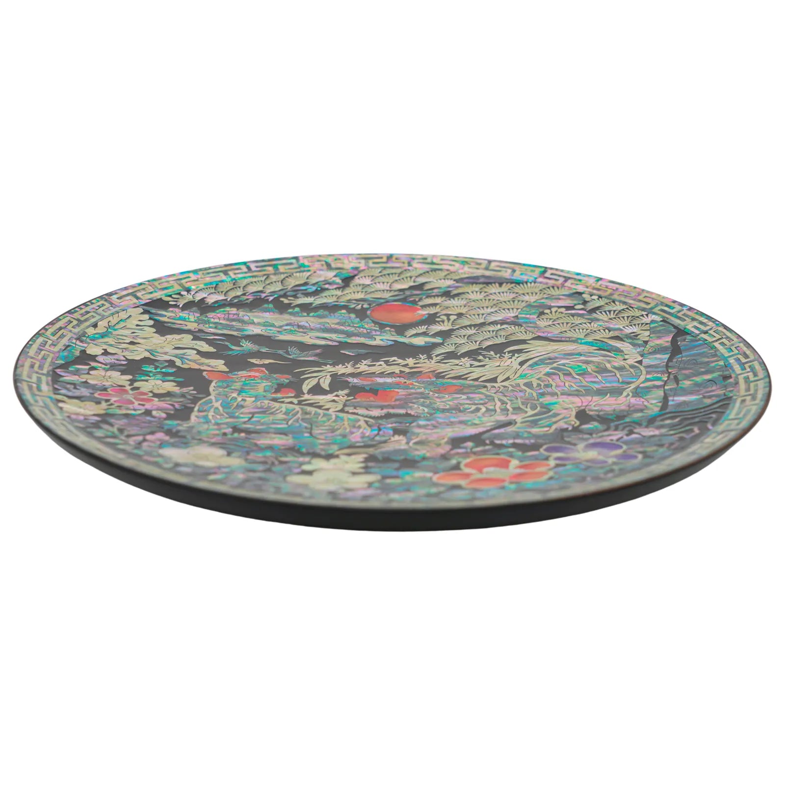 Side view of round mother of pearl decorative plate showing slim profile and smooth lacquered edge, premium handcrafted wall decor