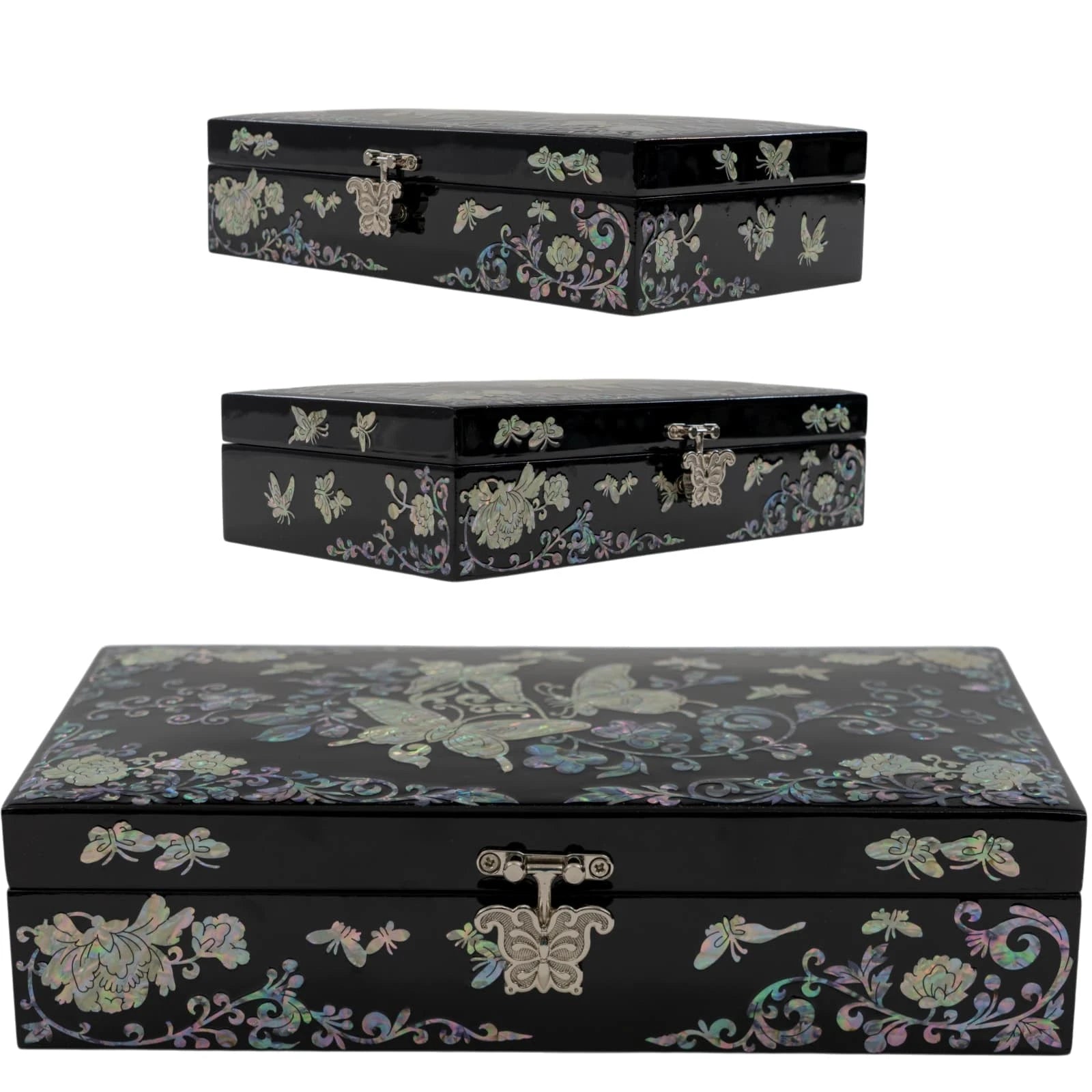 Symmetrical front view of a black keepsake box with shimmering nacre butterfly and vine designs, centered with an ornate metal l