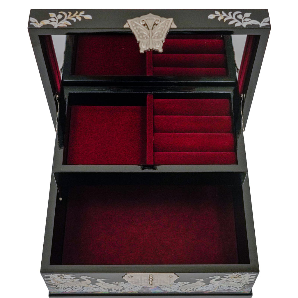 The image shows an open, two-tiered Mother of Pearl jewelry box with red velvet lining in the compartments.