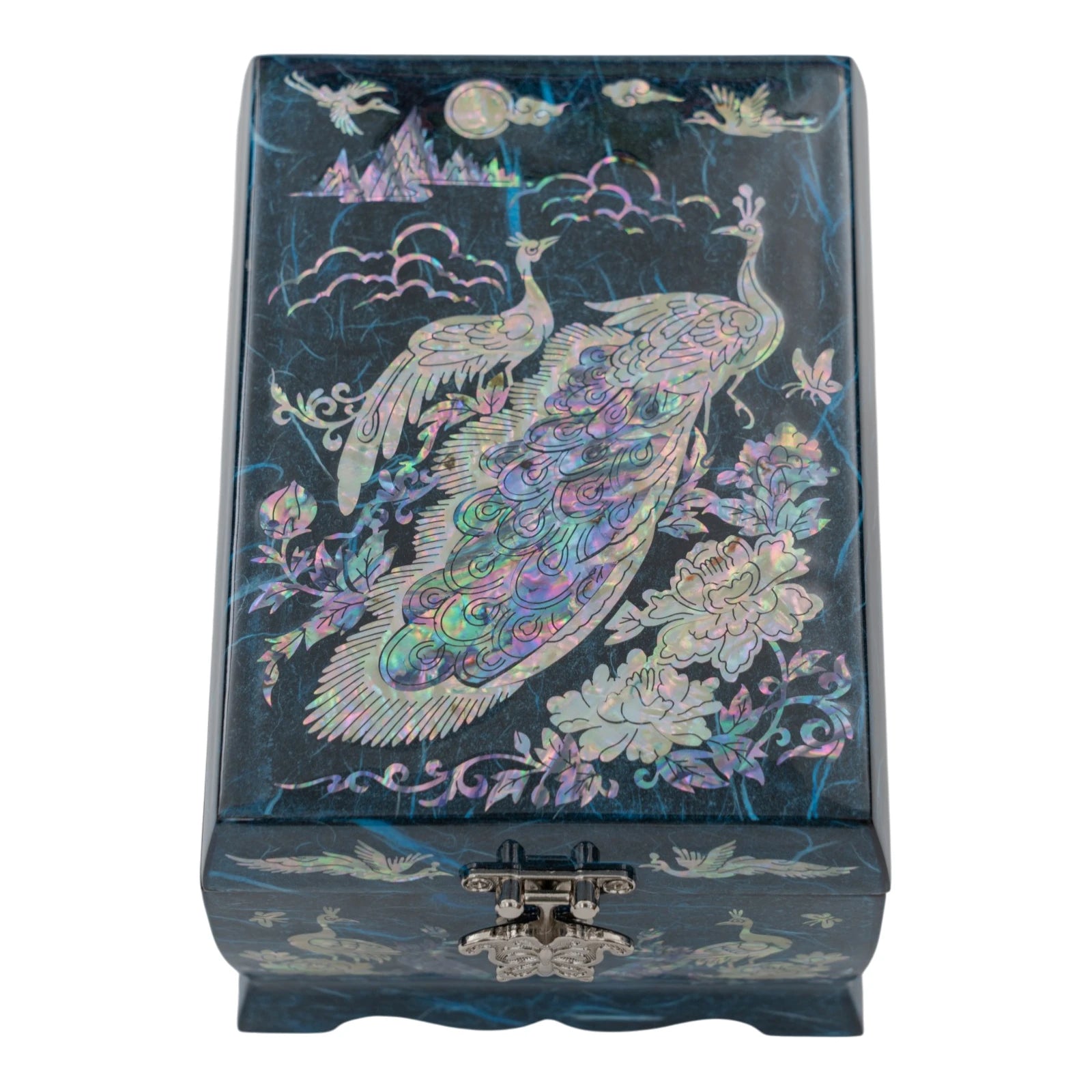 Top-down view of a blue textured jewelry box featuring shimmering mother-of-pearl peacocks, traditional clouds, and a silver butterfly clasp.