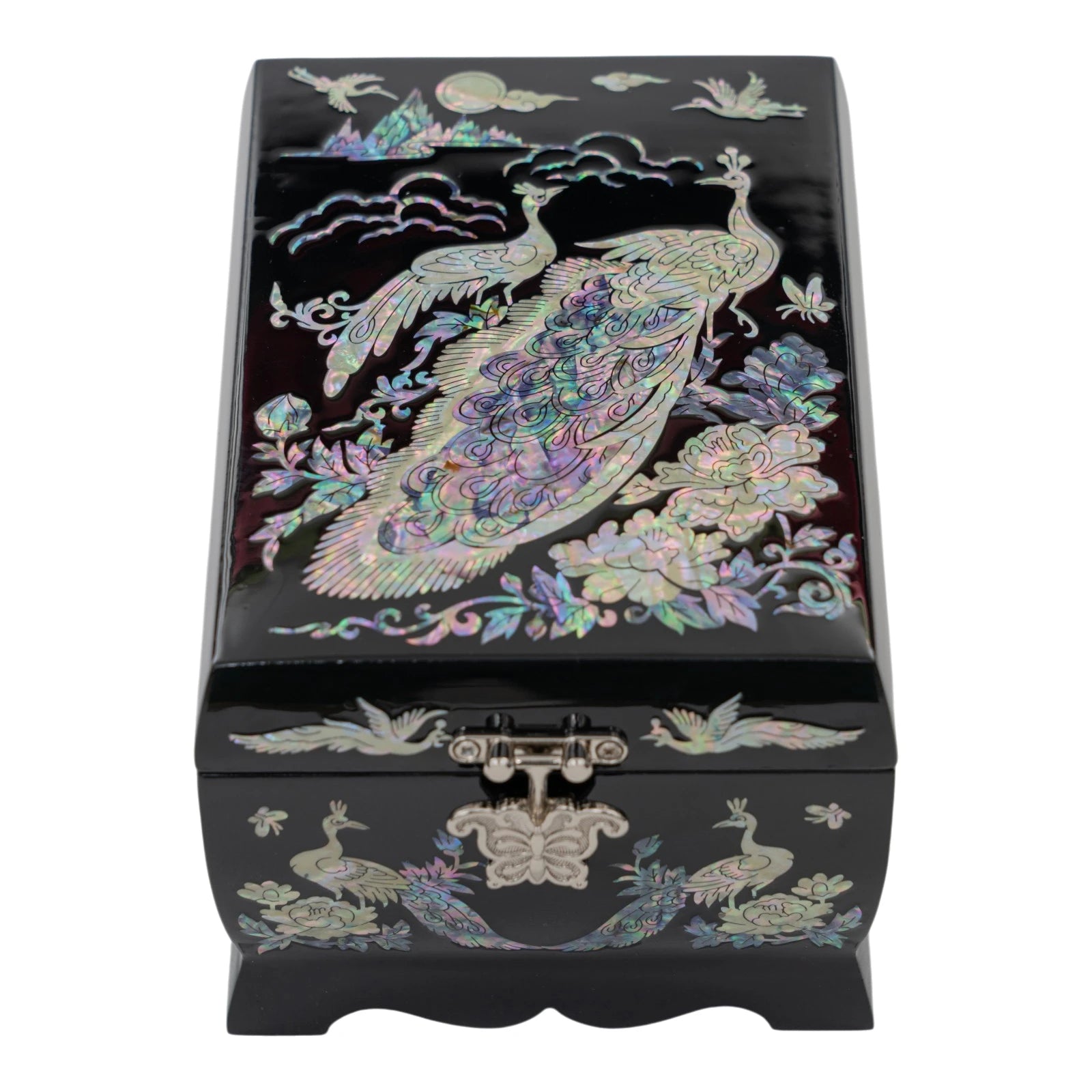 Top view of a black jewelry box showcasing a large mother-of-pearl peacock among peonies under a moon and clouds.