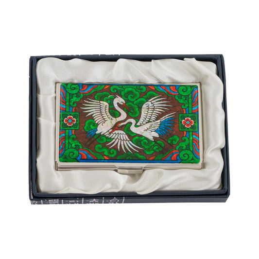 Top view of crane card case resting in silk-lined box for presentation or gift