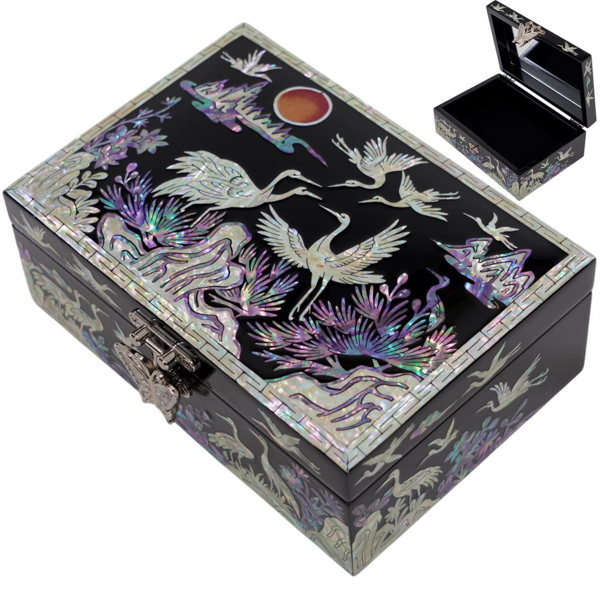 Top view of handcrafted mother of pearl jewelry box featuring crane and landscape inlay with iridescent shell detail
