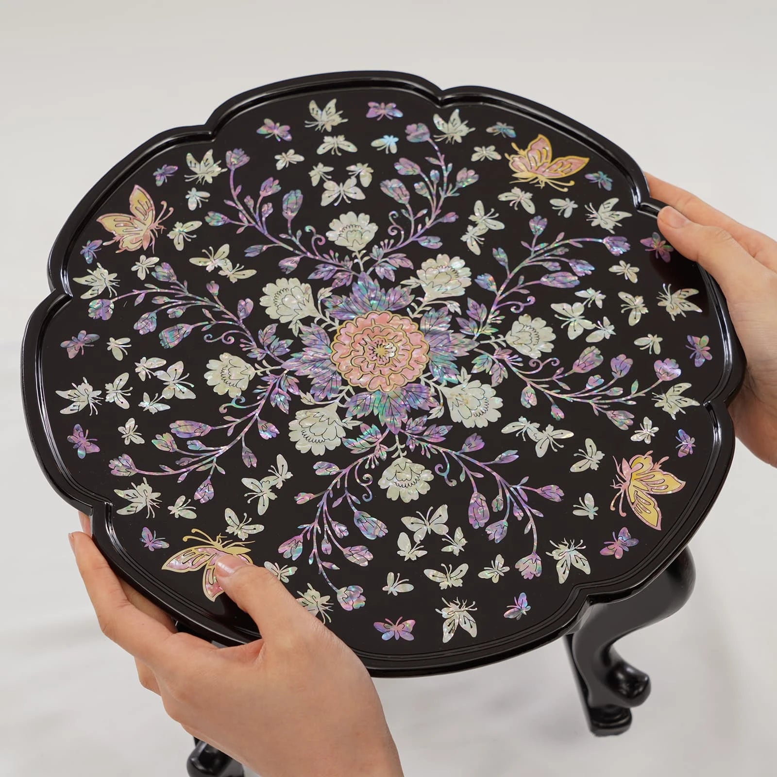 Traditional Korean mother of pearl inlay tray table, round scalloped design with butterfly and flower motif, handcrafted lacquer finish