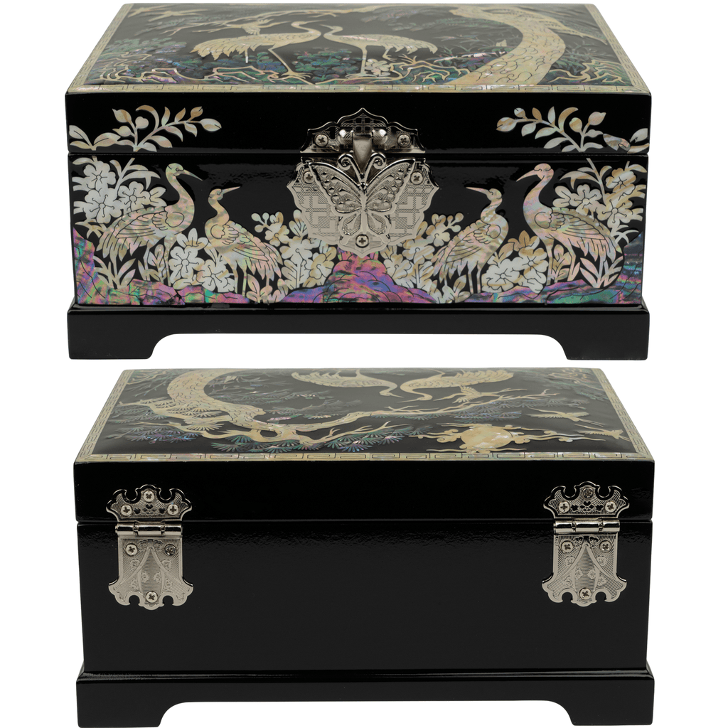 Two views of a black Mother of Pearl jewelry box with ornate crane and flora designs, one showing the front clasp and one the back.