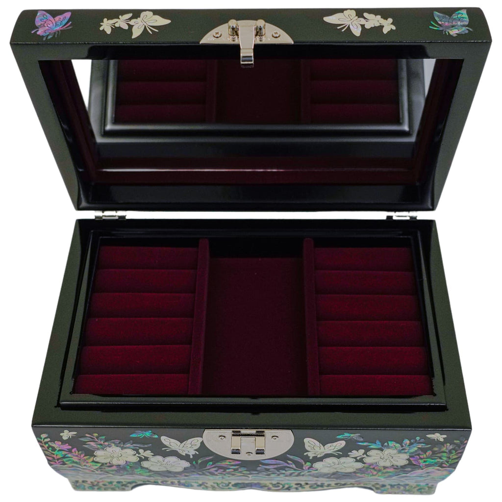 When you open the jewelry box, there is a tray inside where you can put rings or earrings.