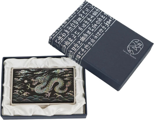 Decorative box with a dragon design and embroidered text on a white background