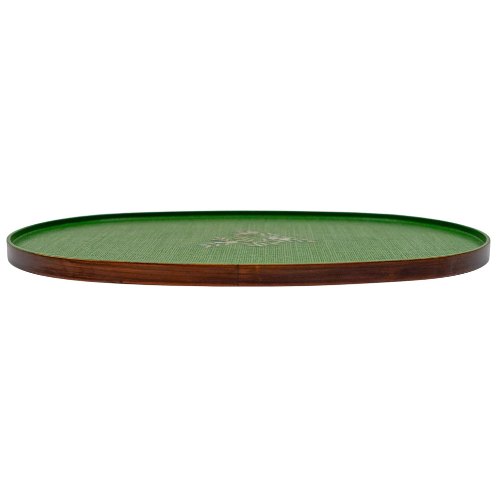 A long, elliptical green tray with a delicate mother-of-pearl design in the center and a wooden rim.