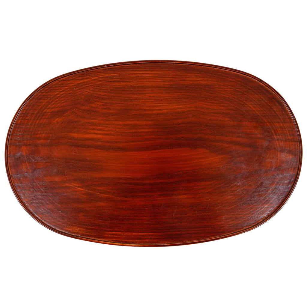 An oval tray with a lustrous lacquered finish in deep mahogany, showcasing the natural wood grain.
