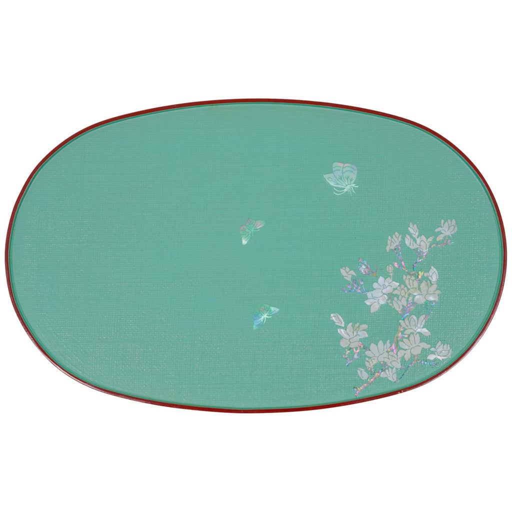 A teal oval tray with a red rim and mother-of-pearl inlay featuring butterflies and a floral branch.