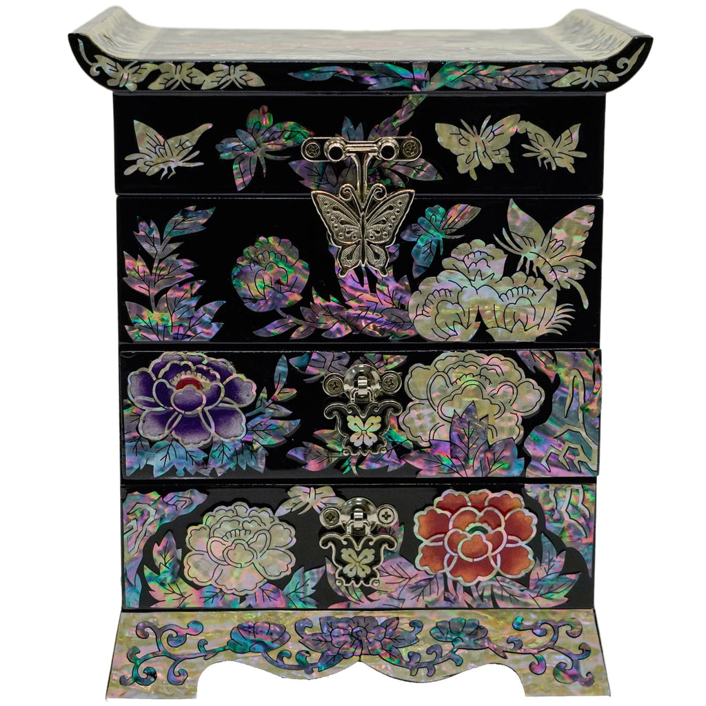 A jewelry box with two drawers, black with a mother-of-pearl floral and butterfly design and metal hardware, on a curved base.