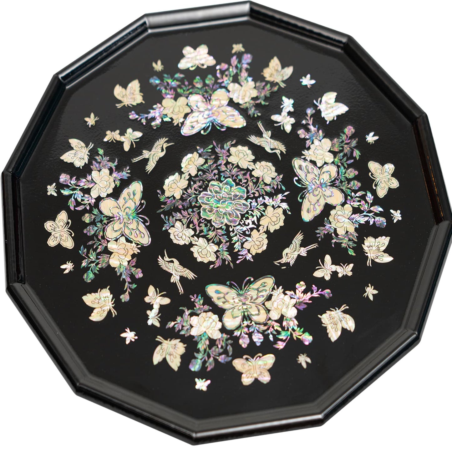 An octagonal tray with mother-of-pearl inlay featuring butterflies and flowers on a black background.