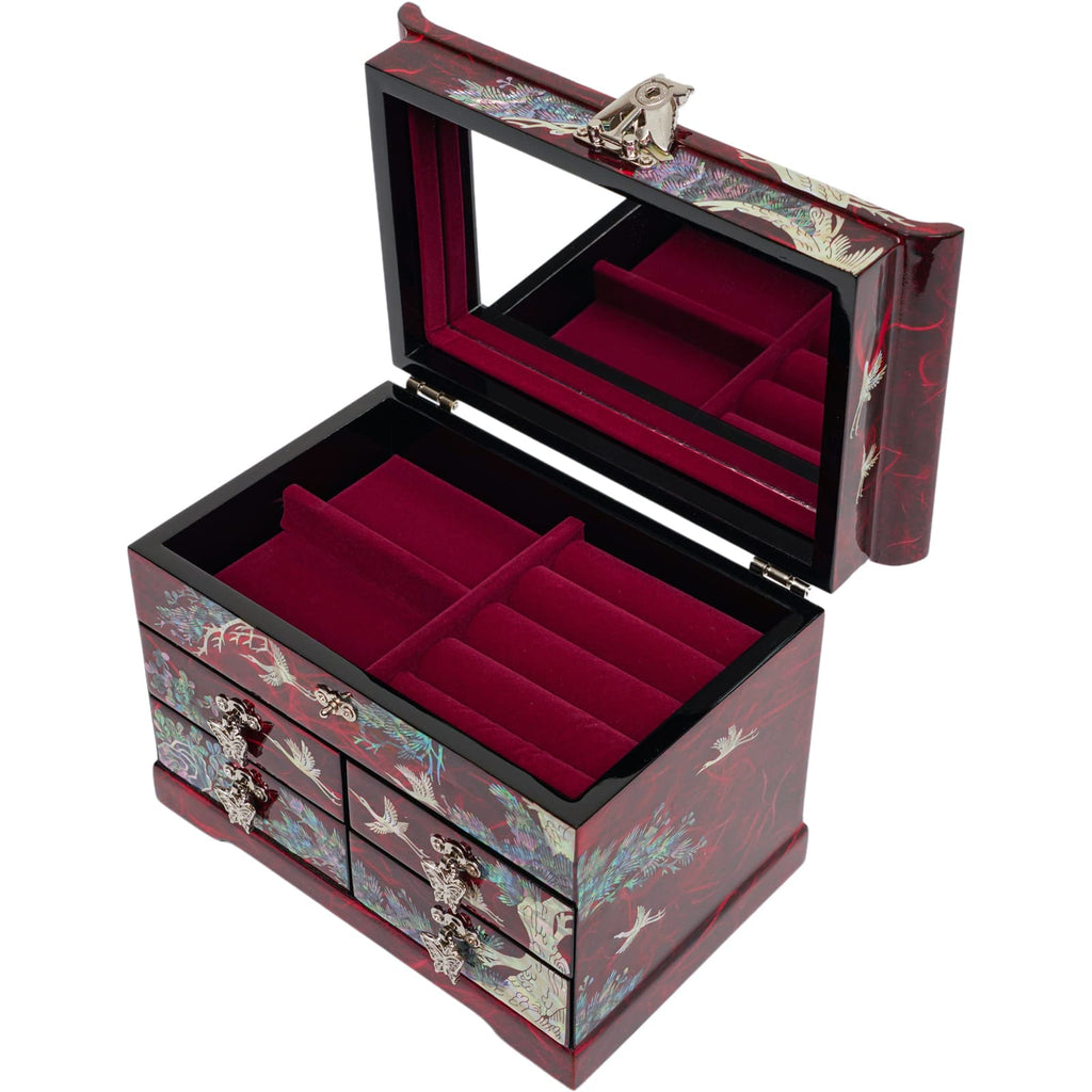  A luxurious Korean jewelry box with a mother-of-pearl inlay, showcasing cranes and pine tree design, featuring a mirror inside the lid and plush red velvet compartments.