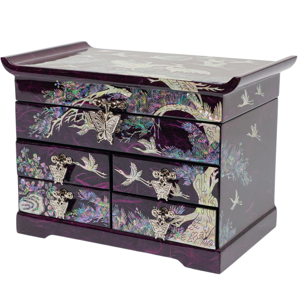  A purple Korean mother-of-pearl jewelry box with crane, pine tree, and butterfly designs, featuring multiple drawers with metal handles.