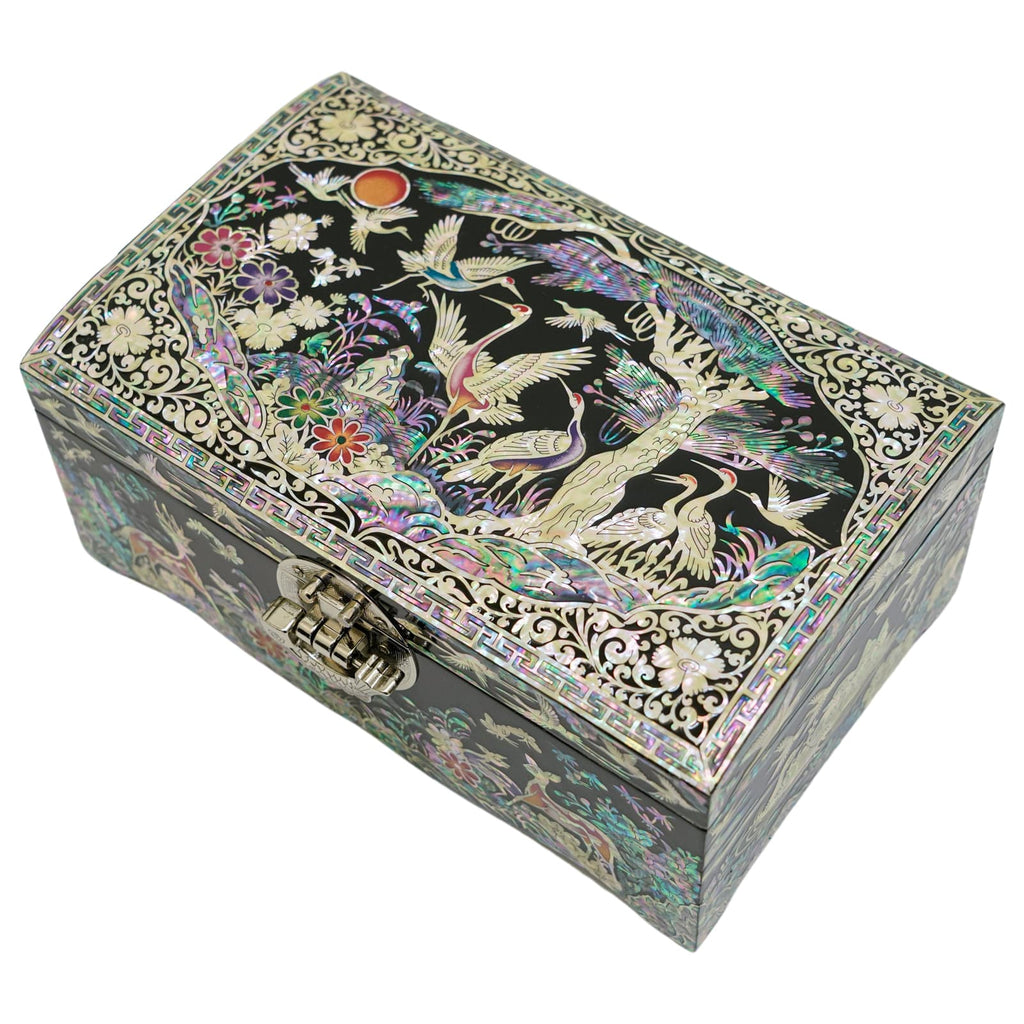 An intricately designed Mother of Pearl jewelry box with detailed cranes and floral patterns, featuring a traditional latch and framed by a geometric border.