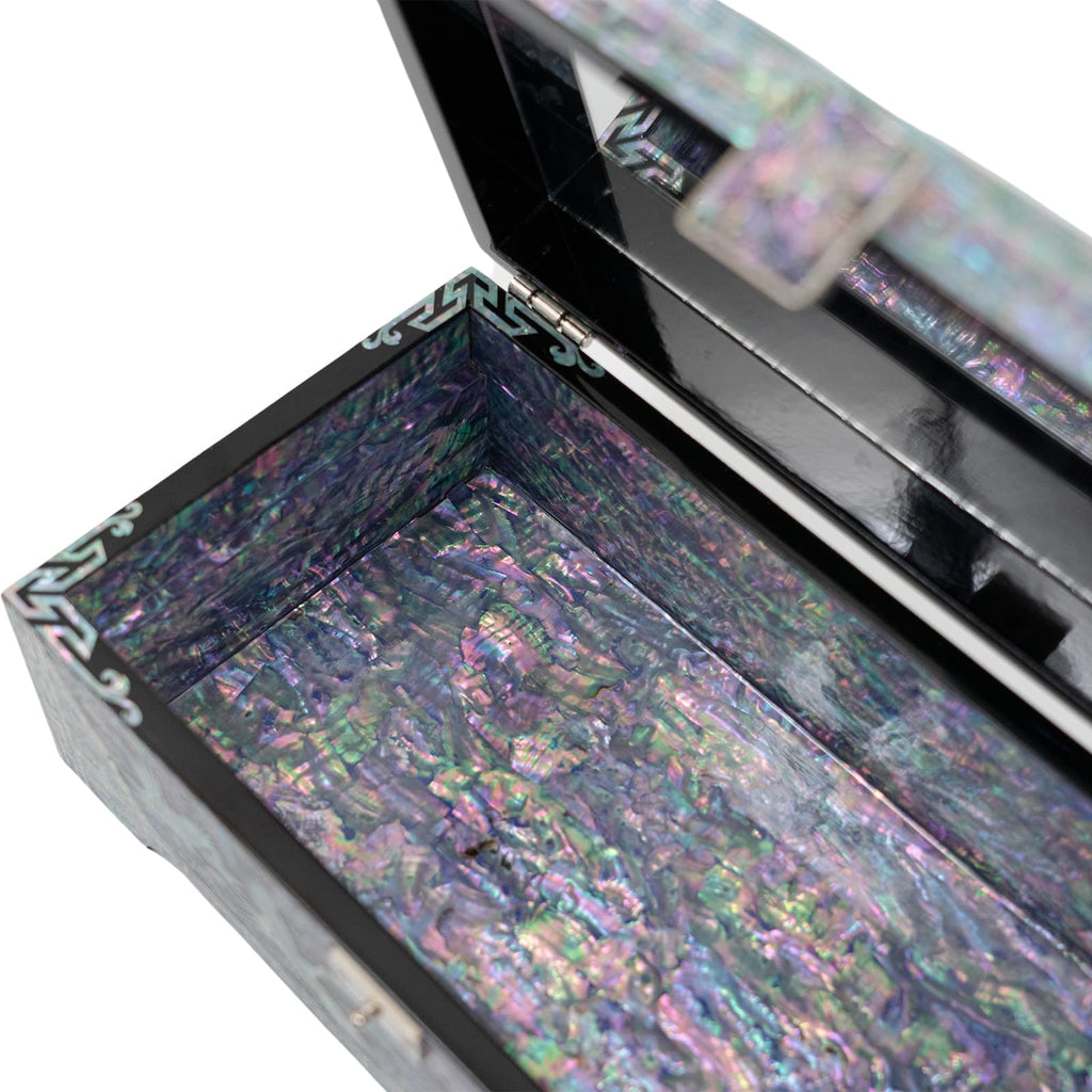 The image displays an open jewelry box interior with a vivid and colorful mother-of-pearl inlay.