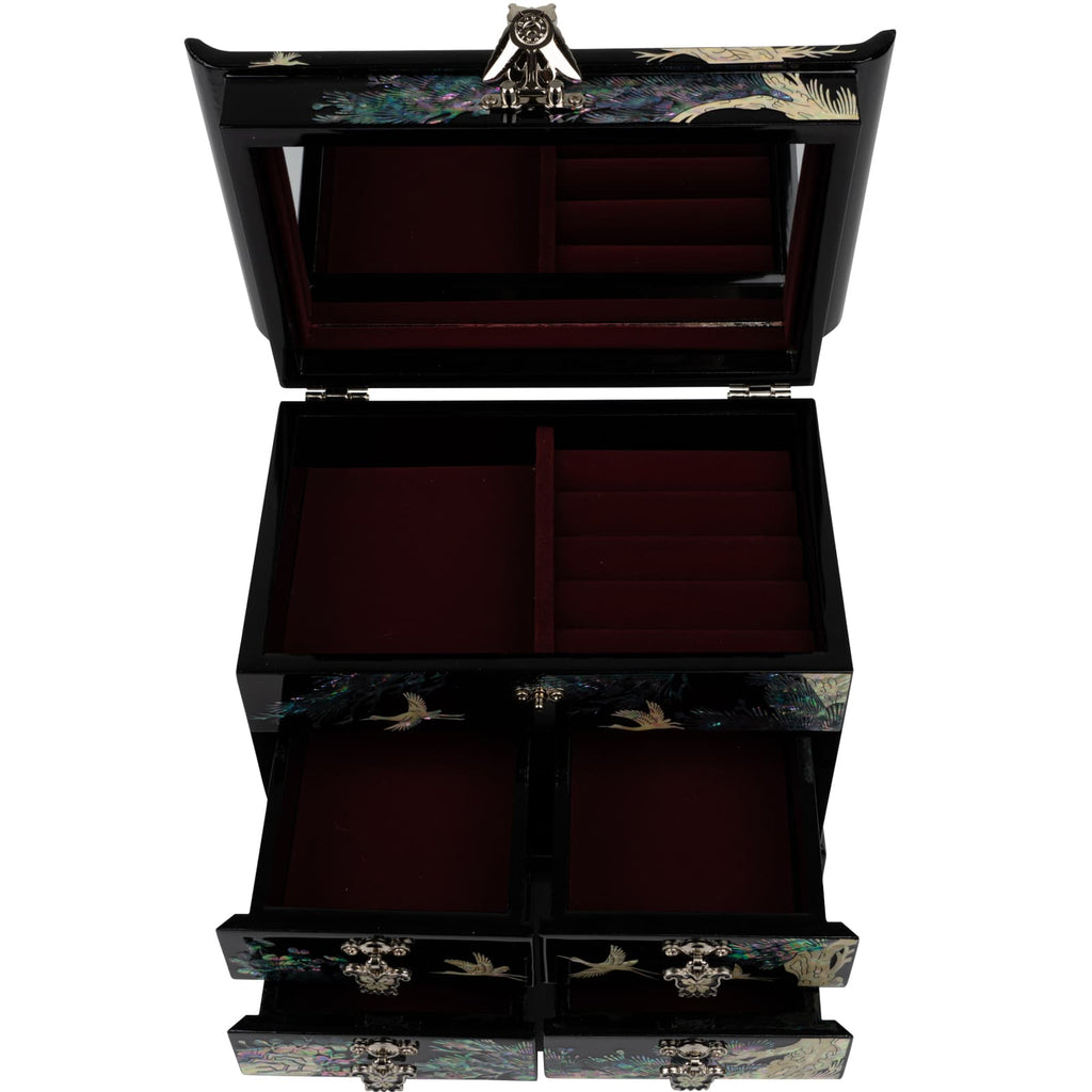 A black jewelry box with open lid, red velvet interior and multiple compartments for organization, adorned with mother-of-pearl crane design.