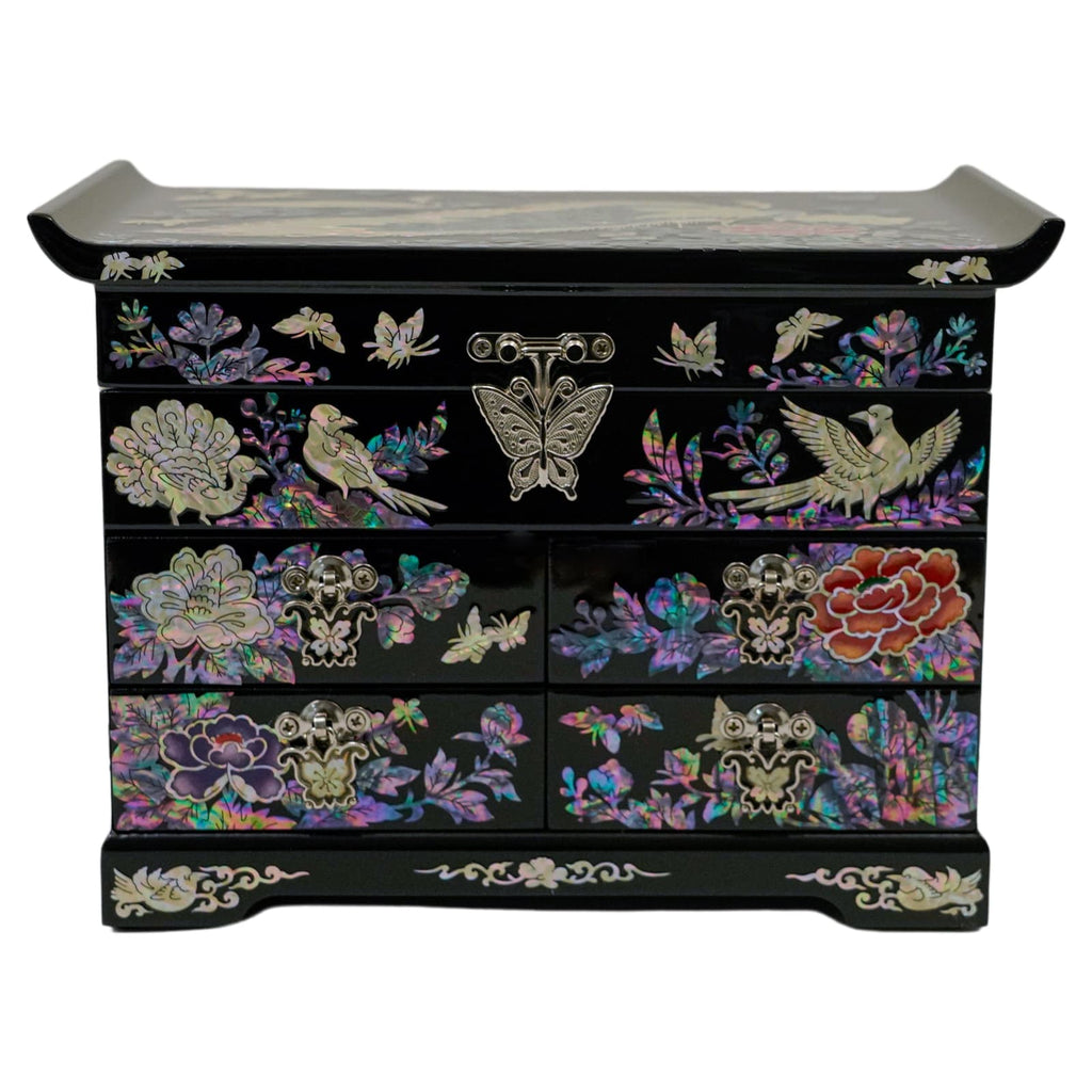 A black jewelry box with mother-of-pearl inlay, featuring birds and butterflies amid floral motifs on the drawers and top, with brass accents.