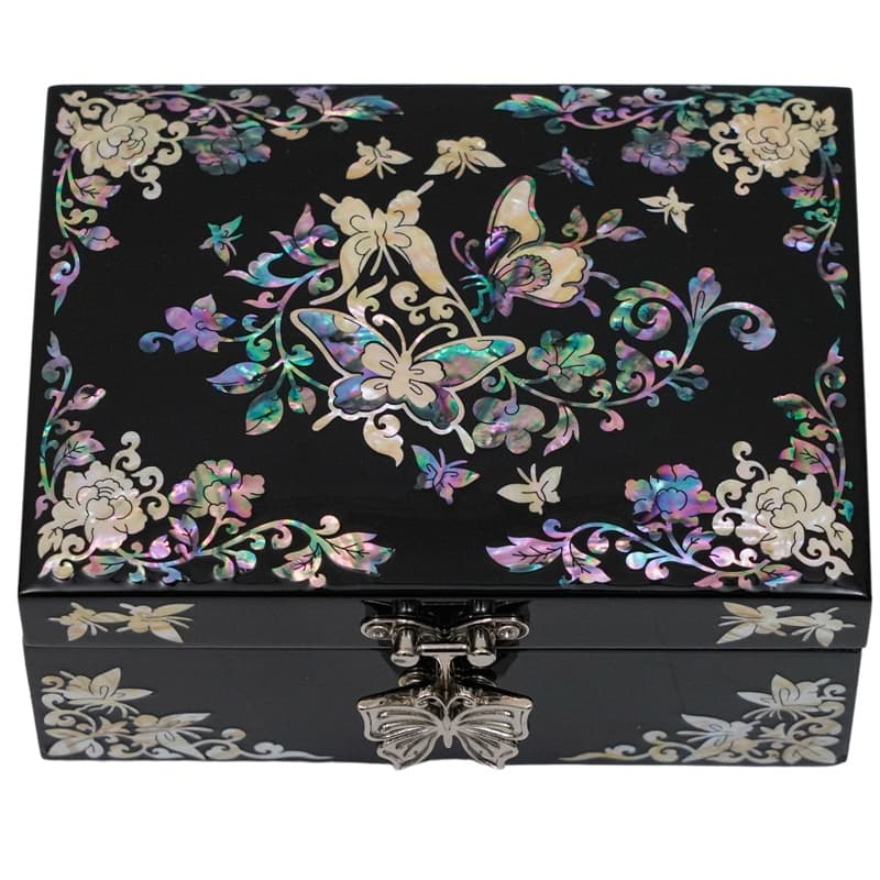 A black jewelry box with a vibrant mother-of-pearl design featuring butterflies and flowers, complemented by a butterfly clasp.