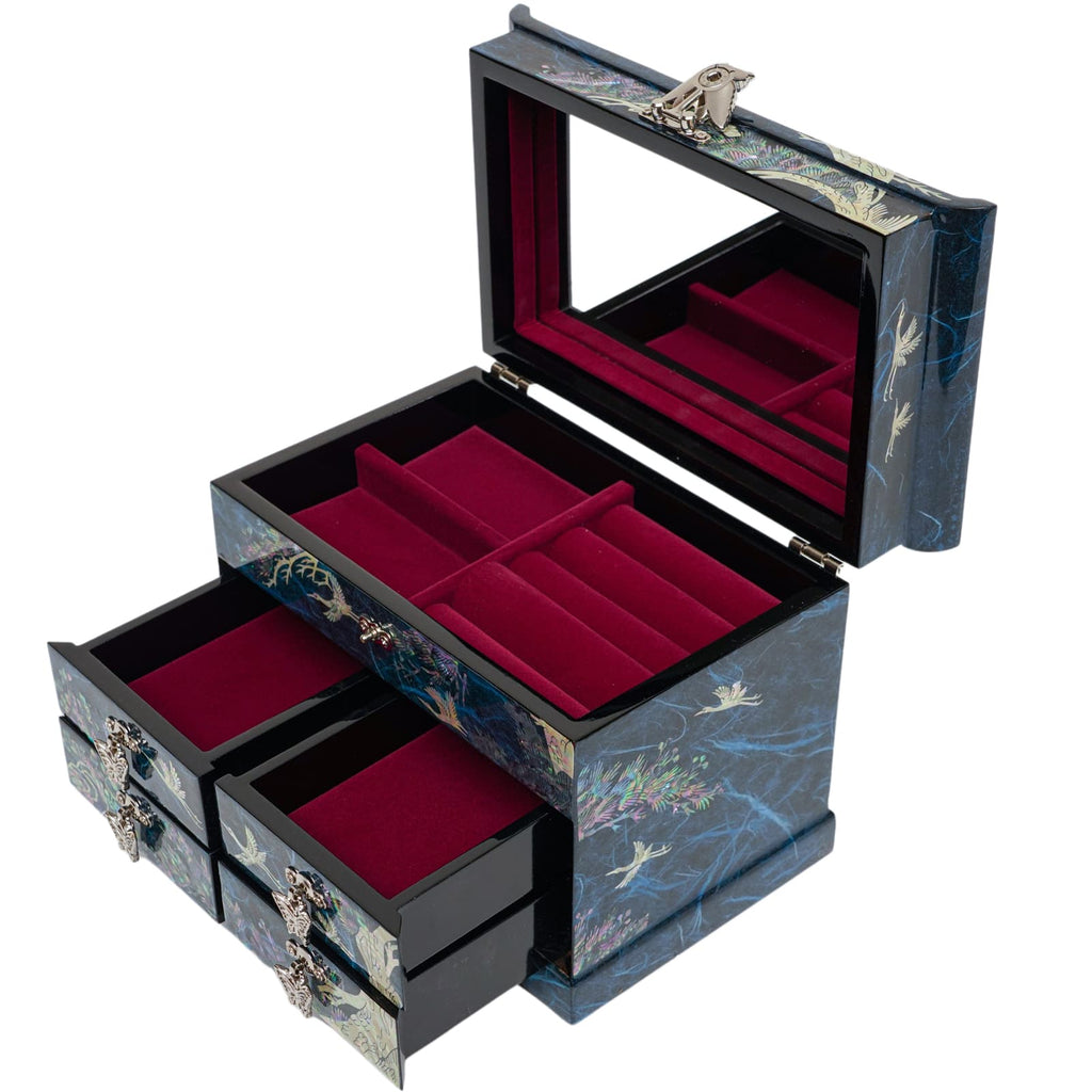 A blue mother-of-pearl jewelry box open to reveal a mirror and plush red interior, with multiple compartments and drawers for storage, accented with crane designs.